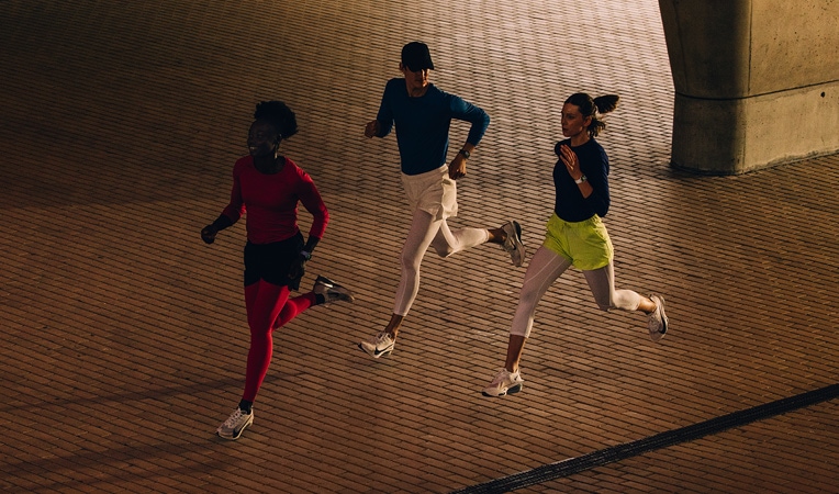 Two people run while wearing Apple Watch Series 11