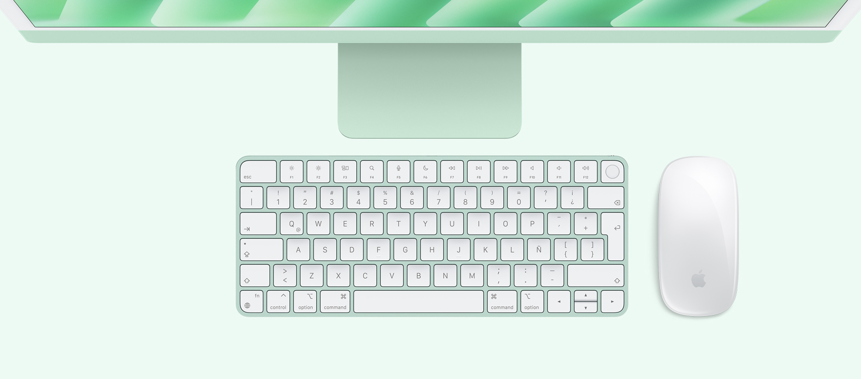 Vista panorámica de una iMac verde con mouse y teclado a juego