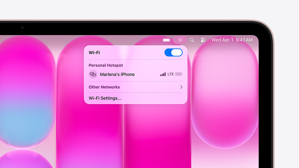 MacBook Neo, blush color, Wi-Fi menu shows Personal Hotspot section with ”Marlena's iPhone” as an option to select