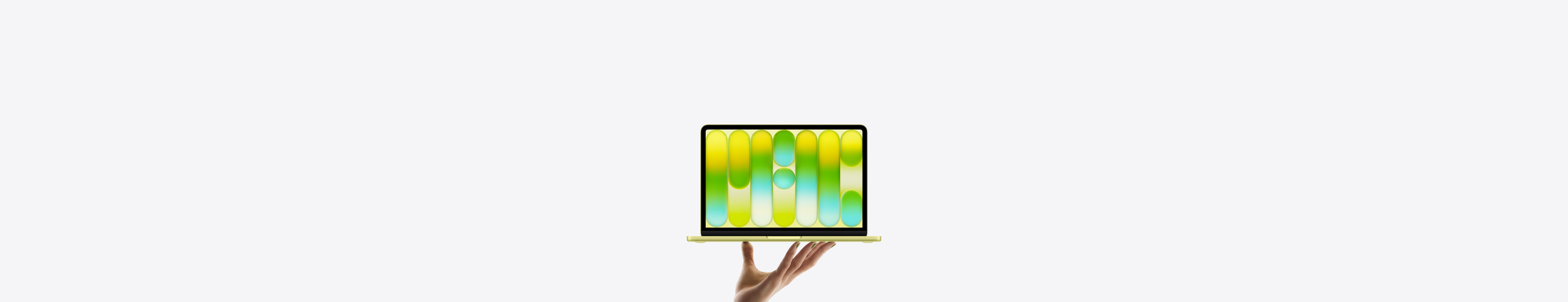 MacBook Neo en un brillante color amarillo cítrico, sostenida en equilibrio en la punta de los dedos de una mano abierta, la pantalla muestra un patrón abstracto y colorido