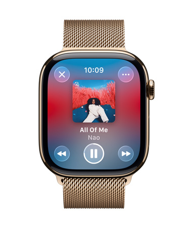 Apple Watch in Gold Titanium with Milanese loop strap, face shows Apple Music playing, translucent Liquid Glass controls